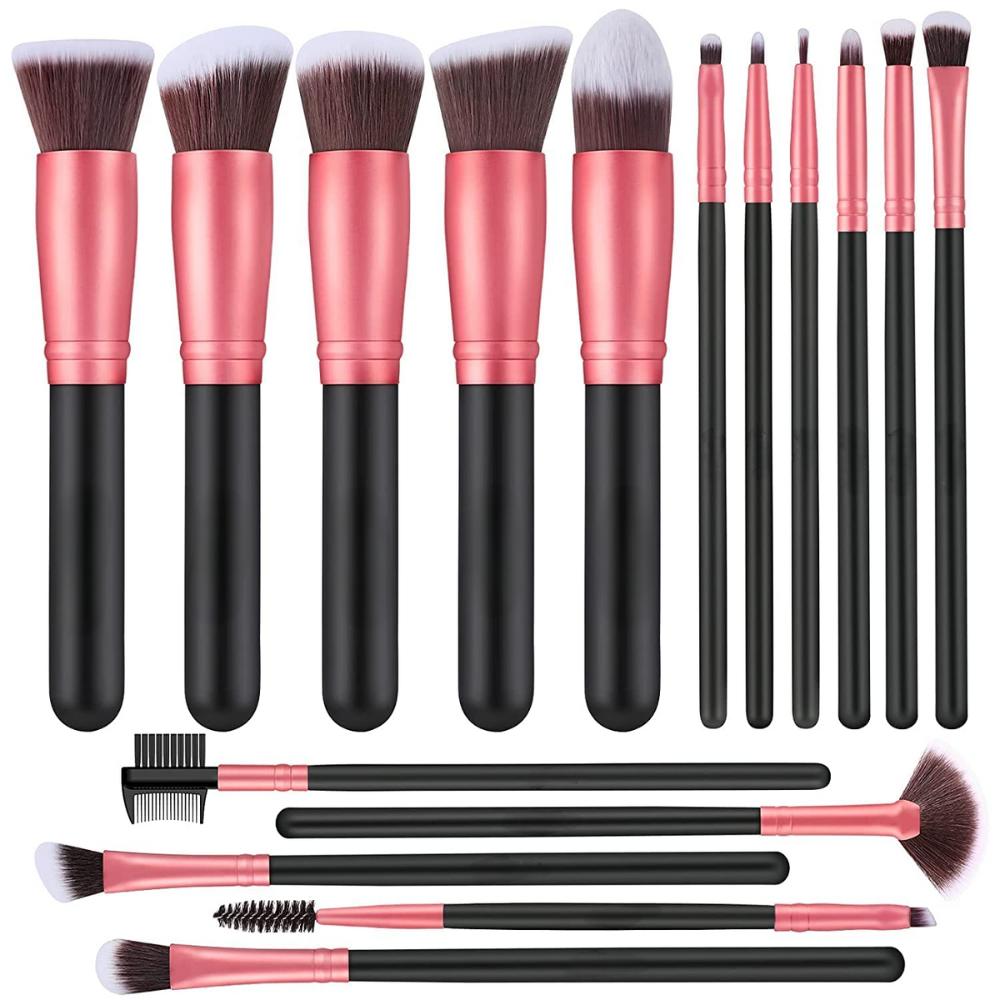 A set of makeup brushes laid out on a flat surface